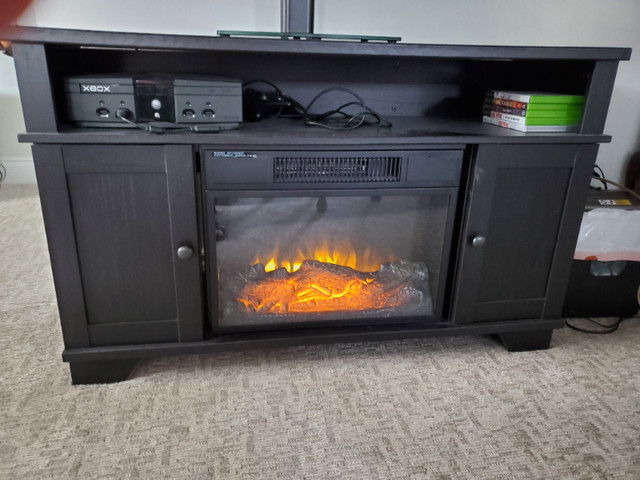 Tv console with electric fireplace. in TV Tables & Entertainment Units in Edmonton