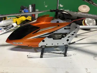 Up for grabs is a Syma Spycat RC helicopter, a fantastic find for hobbyists! This model is in used c...