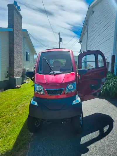 This is a fully enclosed electric mobility scooter, road legal without a license, with a top speed o...