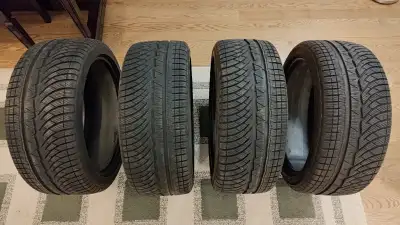 Selling a used set (4) of Michelin Pilot Alpin PA4 235/40r18 winter tires. One tire had a nail punct...