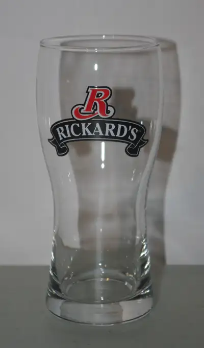 2 10oz. Rickards beer glasses. The Pilsner (w/ribbon) style is 6 1/2" tall and the ale (w/crest) sty...
