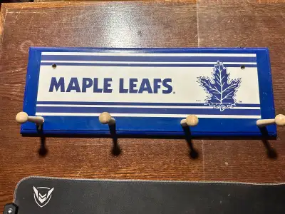Spruce up your space with this vintage Toronto Maple Leafs coat rack! This unique piece features the...
