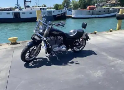2012 883 XL Sportster with 27,000 km. This bike is in mint condition along with new tires, tool bag...