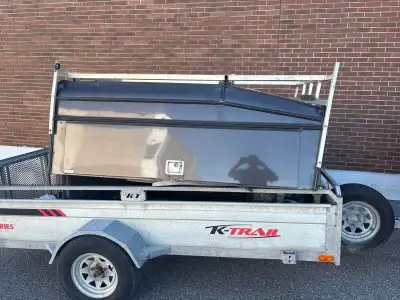 Use truck cap with two full size barn doors, two toolboxes on each side one ladder rack