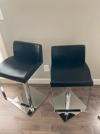 Two adjustable leather Barstools / Chairs from Revolve Furniture
