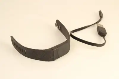 Wristband powers on, but I don't know how strong the battery is. Selling as is. Size Small Model FB4...