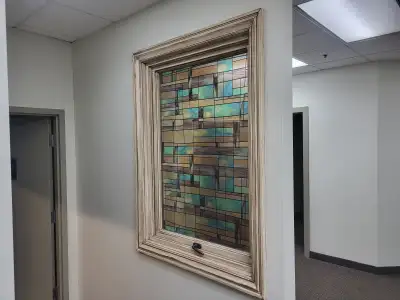 Window set in 2x4 wall, comes with interior and exterior trim kit. Not real stain glass, some kind o...