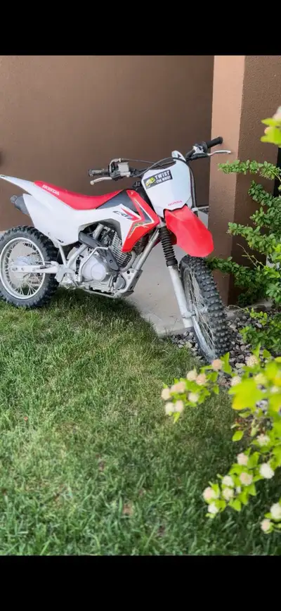 Honda CRF 125 bike has electric start. Has being a really good bike just need to upgrade to a bigger...