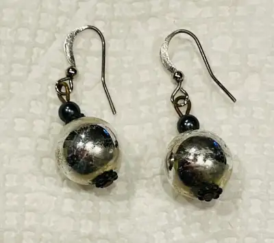 Silver and black coloured earrings, View more
