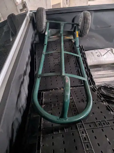 This is a used Harper hand truck in fair condition, perfect for moving heavy items with ease. The st...
