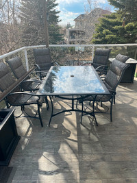 Outdoor glass table with six chairs