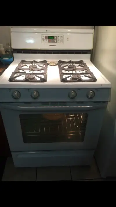 Gas stove in good shape, newer parts and oven racks.