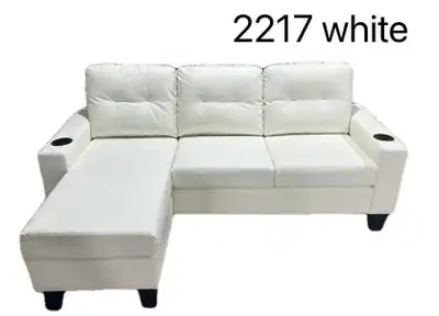 This white sectional sofa features a modern design with comfortable seating and convenient cup holde...