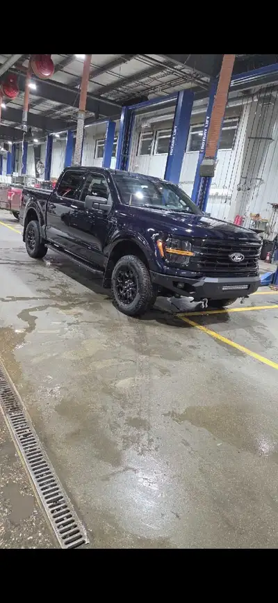 2024 ford f150 crew cab, with the 5.0L v8 in it. It's got around 10k in aftermarket accessories, inc...