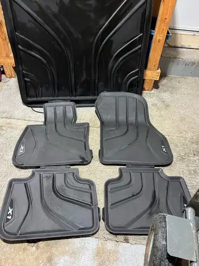 These are used BMW X1 floor mats, designed to protect your vehicle's interior from dirt, spills, and...