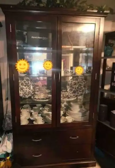 This elegant dark wood China cabinet features built-in lights to showcase your finest dishware and c...