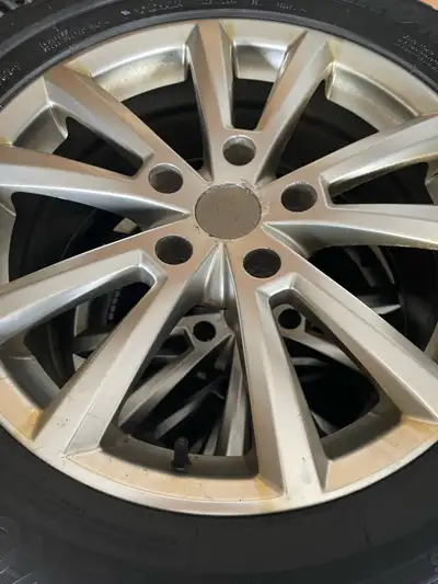 A set of four Excellent Yogohama Ice gurd winter tires with rims. The tire number is 255-55-18. They...