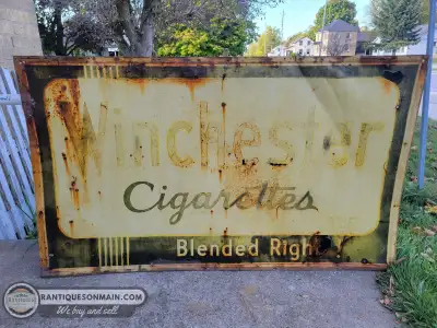 1940's era Winchester sign measuring approximately 60" x 36". Great patina on this one. Nicely faded...