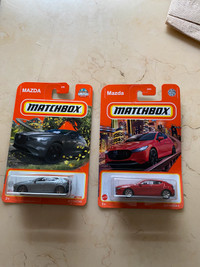 Two Mazda 3 hatch matchbox car models for sale