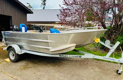 15' WOLF Boat – Perfect Condition with Nearly New 20 HP Suzuki Outboard This custom 15' WOLF is in p...