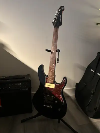 Selling my Yamaha PAC611HFM electric guitar, a versatile instrument perfect for various music genres...