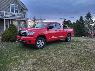 This 2010 Toyota Tundra SR5 is a robust and capable pickup truck featuring a powerful engine, spacio...
