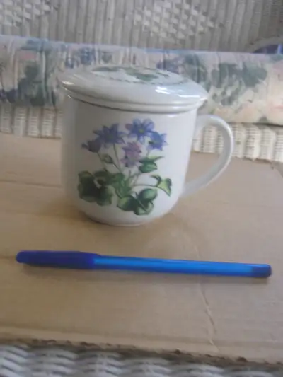 pretty tea mug with infuser and lid, View more