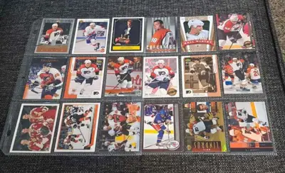 Selling 18 collectible Eric Lindros hockey cards including Rookie cards comes with album sleeves ple...
