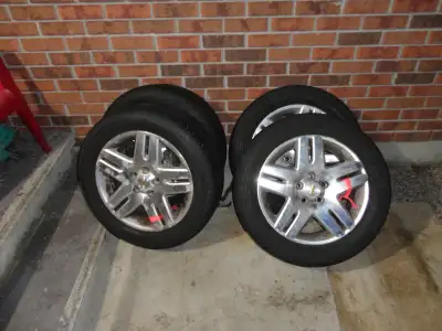 Almost New 225 55 17 Firestone FR710 M+S tires on five star aluminum Chev Impala rims. 5x115mm bolt...