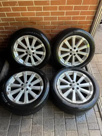 Bridgestone All Season Tires, like new with lots of tread left, no leaks. Rims have minor cosmetic s...