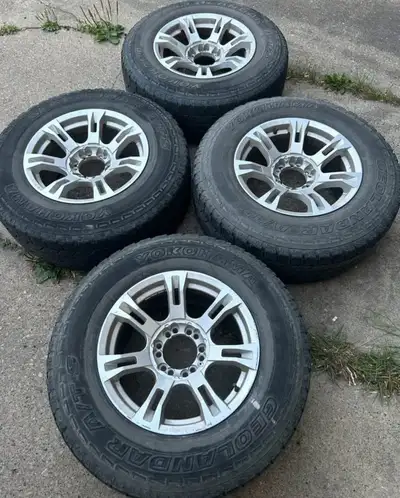 Set of 17 inch rims and tires 6x139.7 dual bolt pattern Center bore is 106.1mm Clean set no damage M...