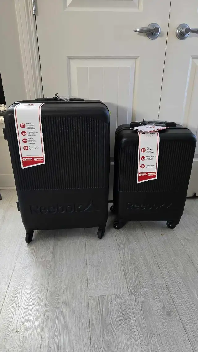 2 Brand new Reebok luggage