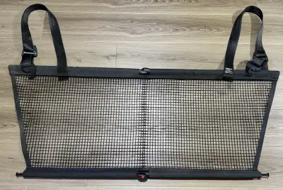 Net for rear of car - barrier for pets Genuine Volvo part Great condition Folds for easy storage AS...