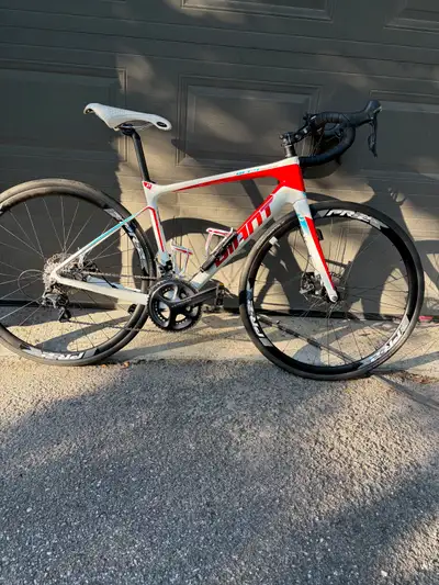 Carbon fibre road bike in excellent condition, View more