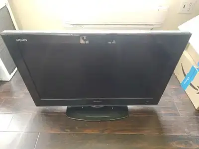Sharp 32" LCD TV with stand and wall mounts included. Tv Remote, Original Box, everything. Pickup in...