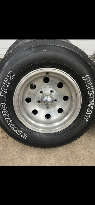 Set of 4 eagle alloys rims with 235/75R15 tires (8/32nds). Had them on a chevy fullsize van . 5x5 (...