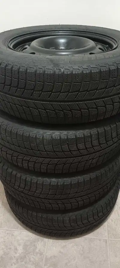 I have a set of 4 Michelin X-Ice Winter Tires on Steel Rims for sale The size of the tire is 215/65R...