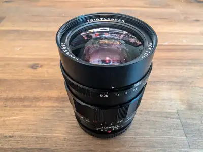 Voigtlaender Nokton 25mm f/0.95. I used it with a Panasonic GH5. For MFT cameras
