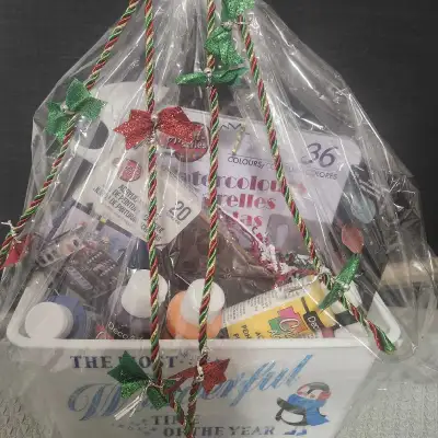 This charming art supplies gift basket is perfect for inspiring creativity! It includes a variety of...