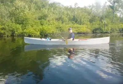 Two homemade open topped style kayaks (one blue, one grey) for sale, these are in rough shape after...