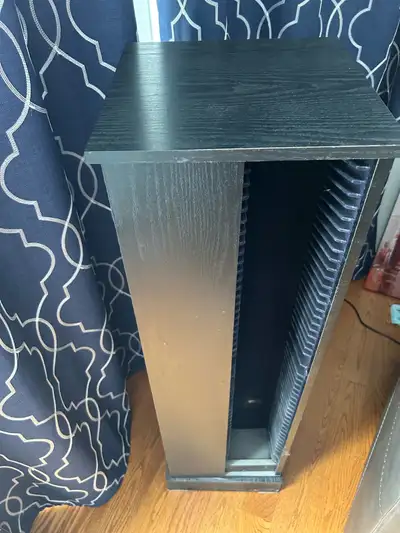 This swiveling black CD tower stand is a great way to store your music collection. It has a sleek de...