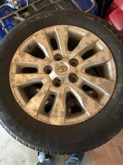 Factory Toyota wheels and studded nokian tires. 275/55R20