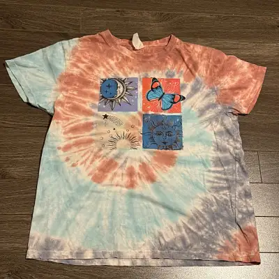 Cute tie-dye T-shirt featuring a unique design with celestial designs. It's in great condition and r...