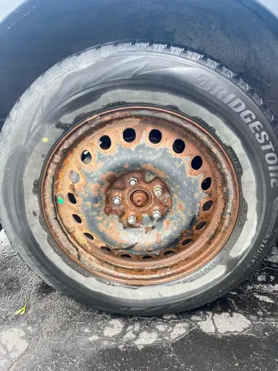 Bridgestone 235 55 R18 winter tires with rims selling the whole set. four tires and four rims includ...