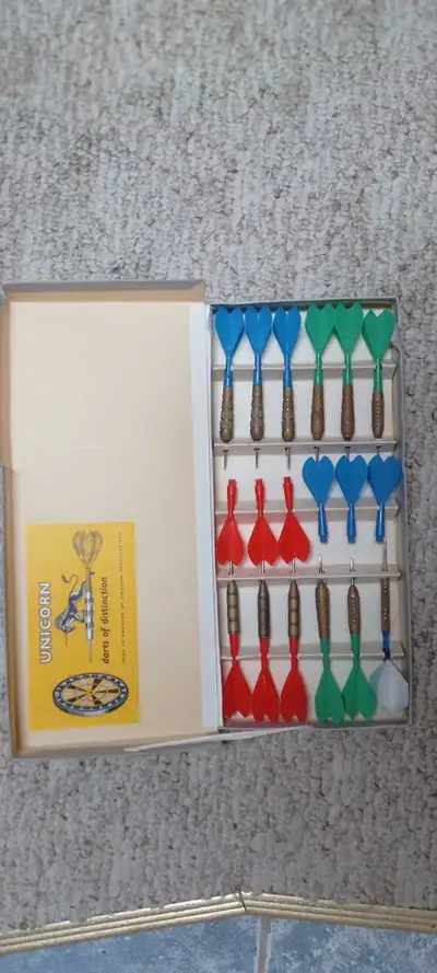 Vintage Set of 12 Unicorn Brand darts with 6 replacement feather in original box. As well as a next...