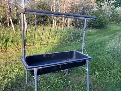 Behlen County horse hay feeder. We used it to feed square bales to horses. No holes in the tub, one...