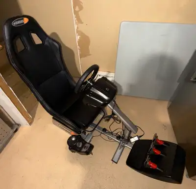 Playseats gaming chair & logitech G25 racing wheel, View more