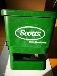 Hand held spreader by Scotts, for grass seeds and lawn food.