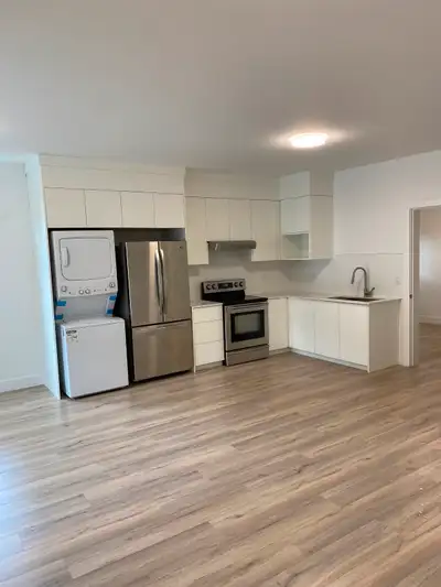 Spacious (700 SF) 1-bedroom ground level suite with separate covered private entrance and covered po...