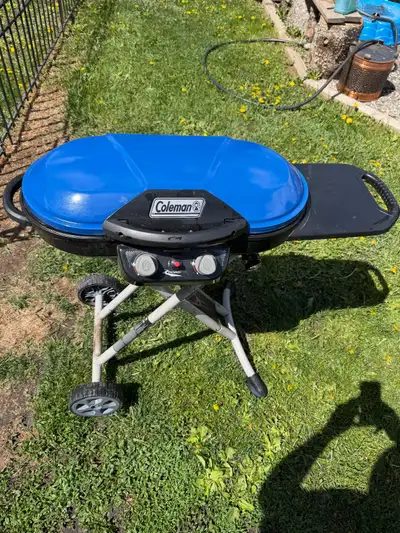 Like new, portable propane bbq. Folds up for easy storage, can use a 1lb propane tank ( little green...